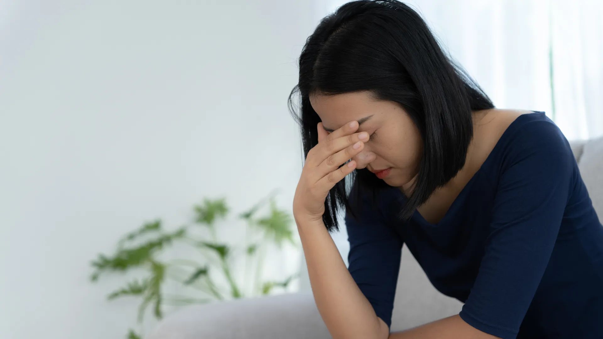 体調不良の女性